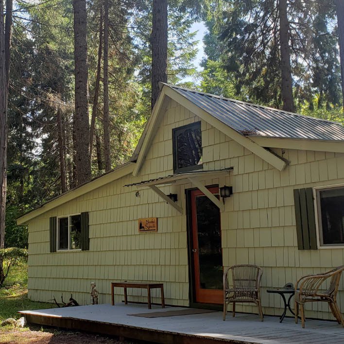 Exterior of the Blissful Solitude Cottage at Azalea Grove Getaway, one of our vacation rentals available for reservation
